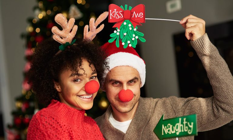 Couple with red nose and nose rings pose for a picture