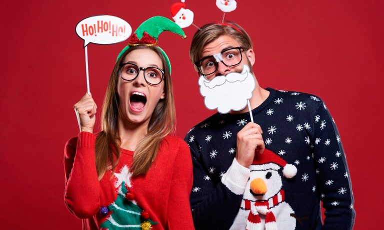 Couple posing at Christmas photo booth rental in houston