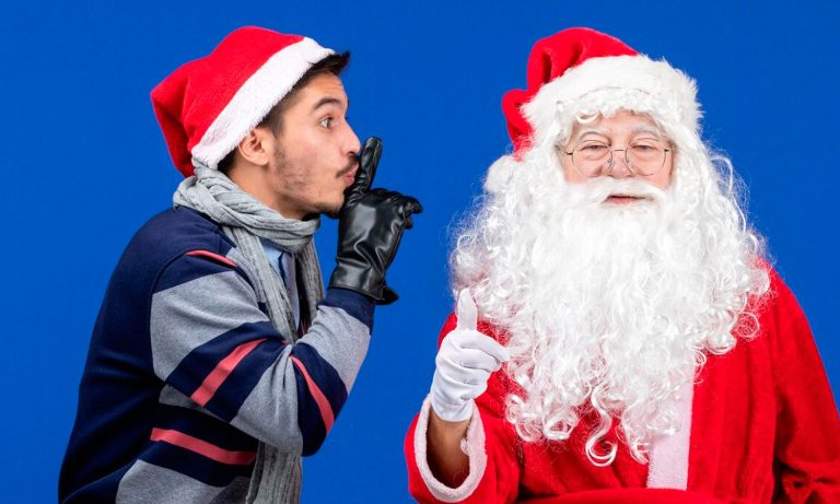man in santa claus costume and a man in a grey jacket